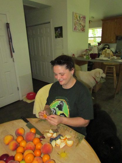 Laura Vees cutting fruit