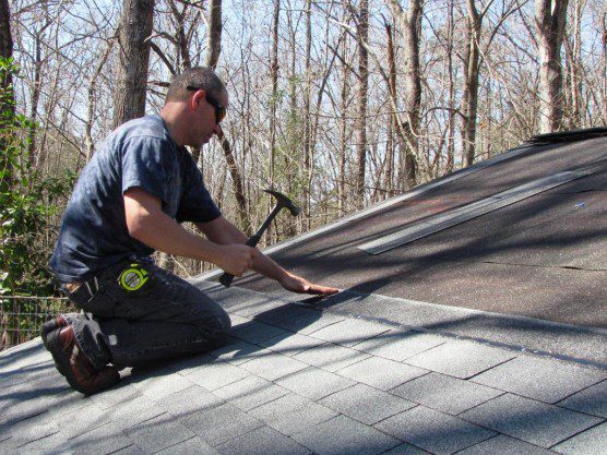 Matt Messer working on roof